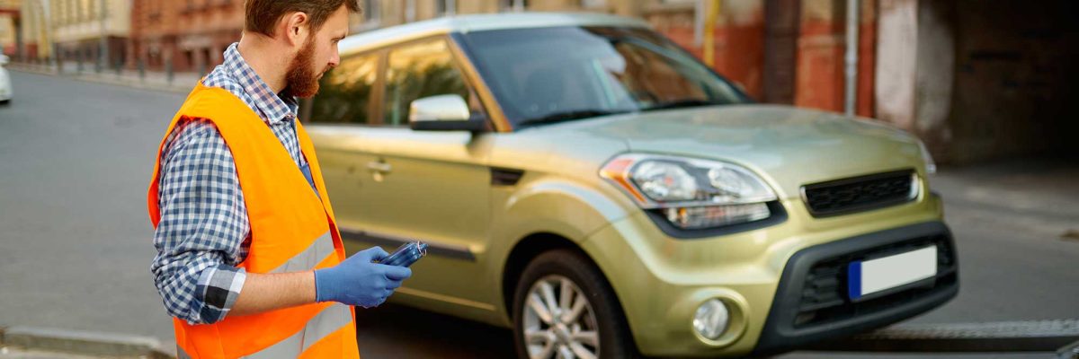 male-road-worker-monitoring-car-loading-process-2022-02-16-17-24-50-utc-1.jpg